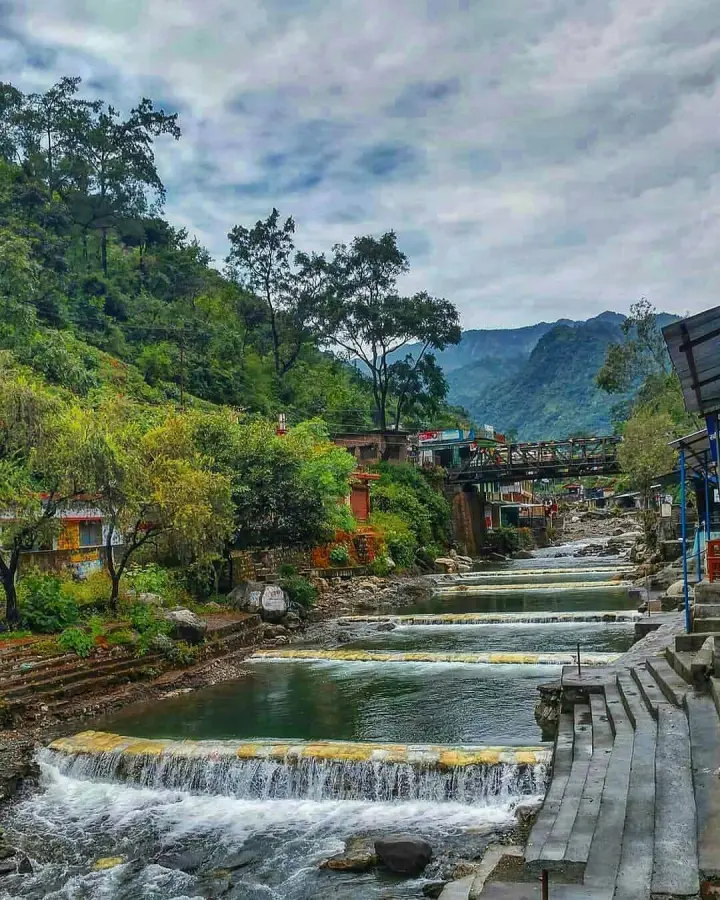 Water over stepped limestone at Sahastradhara